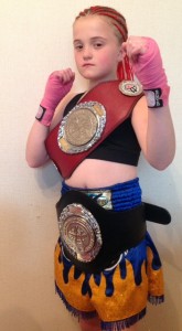 WINNER: Angel proudly displays her two title belts