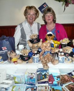 GIFTS: Souvenir secretaries Barbara Arthurs and Susan Haines sell the goodies, helped by David Haines, Treasurer