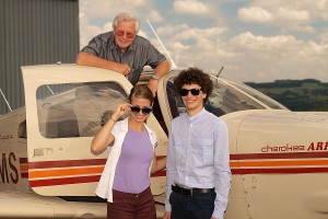 TAKE-OFF: Hanna and Zsolt with Rotary club member Malcolm Hill before their flight TAKE-OFF: Hanna and Zsolt with Rotary club member Malcolm Hill before their flight