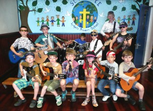FANTASTIC: St Anne's Rock Raiders took to the stage with founder Andrew (back right) to perform for other pupils, staff and their parents at the end of the term