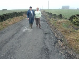 FED UP: The Holroyds plea to repair damaged road.