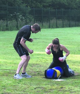 ENCOURAGING: Richard helps individuals on the different exercises