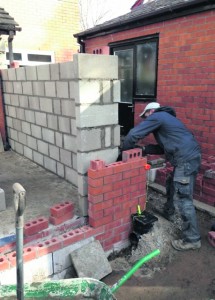ON SITE: The team work hard on a build