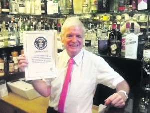 p12 phil's gins old bell World record holder Phil Whiteman with certificate and some of his gins