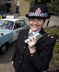 Greater Manchester Police celebrate the 40th anniversary of the opening of Oldham Divisional headquarters. Ch Supt Caroline Ball is pictured with police cars from today and the 1960s. Also pictured are Liz Hibbert and Colin Jackson - both members of staff who were working at the police station on its first day of operation and are still there. Corporate and Media Imaging,  Corporate Communications Branch,  Greater Manchester Police. 0161 856 2777. Picture Desk 0161 856 2279.
